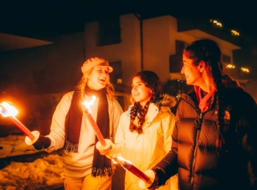 Students on an evening torchlight hike